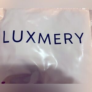 Brand new never worn LUXMERY BODY SUIT!